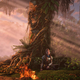 Aloy leans against a tree next to a campfire in Horizon Forbidden West.